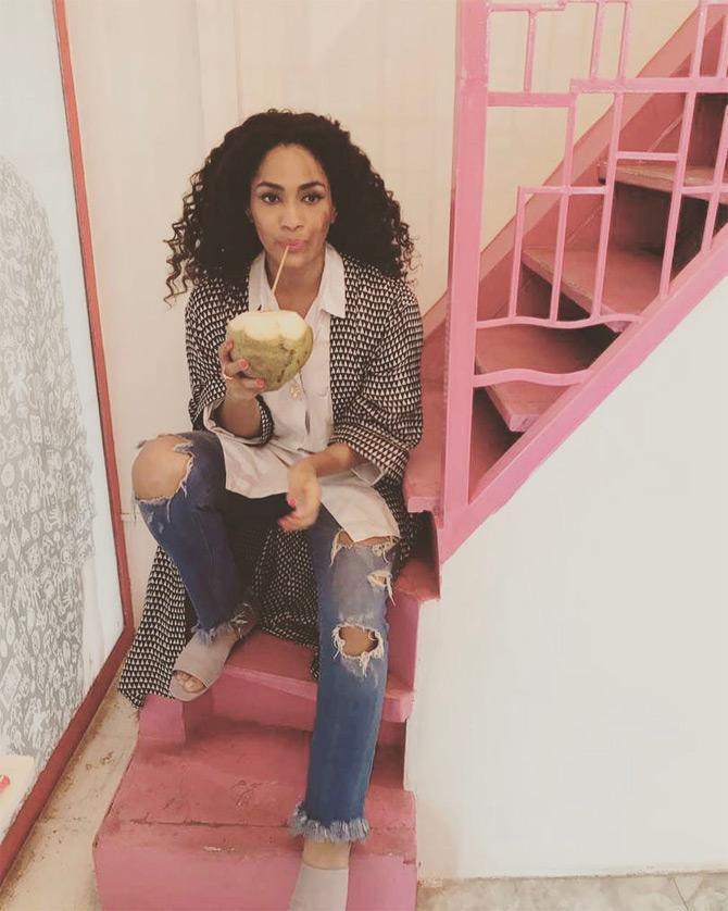 In photo: Masaba Gupta enjoys fresh coconut water in between shoots at her Kala Ghoda store in Mumbai.
