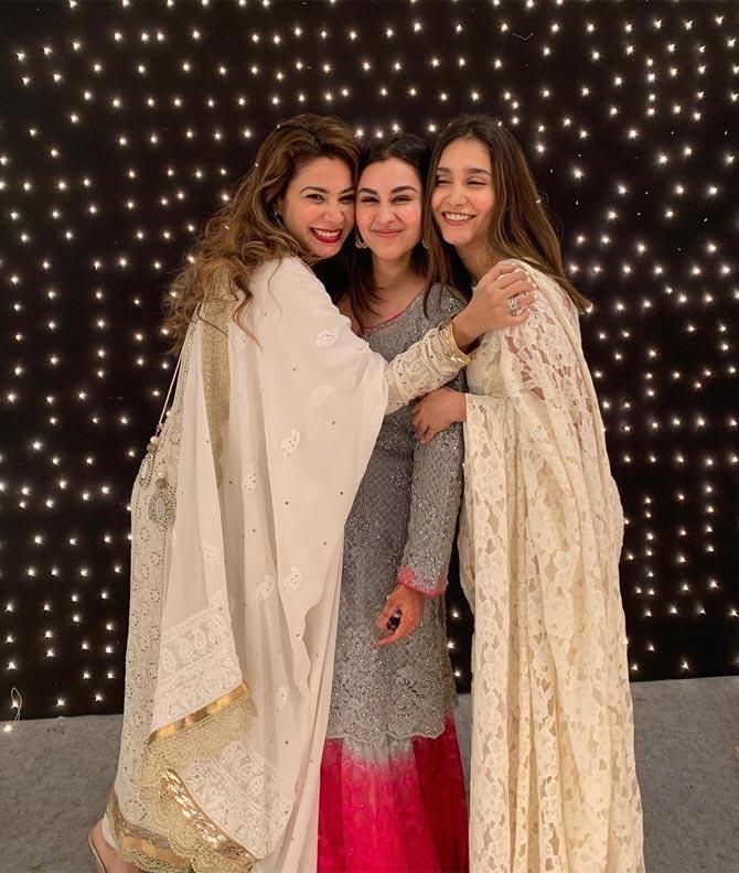 She stands out from her sisters in this white full-sleeved outfits with silver details catching out attention. 