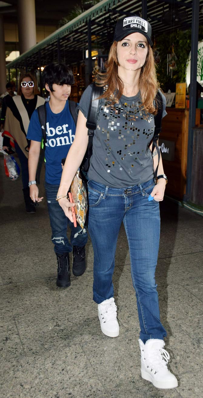 Sussanne Khan was snapped at Mumbai Airport with her sons Hridhaan Roshan and Hrehaan Roshan, as they returned from their French alps vacation. Sussanne along with ex-husband actor Hrithik Roshan, Rakesh Roshan, Pinky Roshan, Sunaina Roshan and daughter Suranika rang in the New Year in Rhones Alps, France. (All photos/Yogen Shah)
