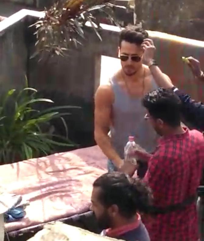 The actor was seen wearing a grey coloured vest with denim and sunglasses. The actor was seen getting himself ready for a shooting sequence.