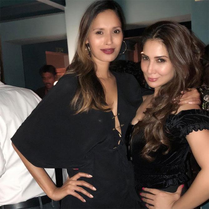 She oozes oomph in this dress with a plunging neckline and posing with one of her close friends actress Kim Sharma.