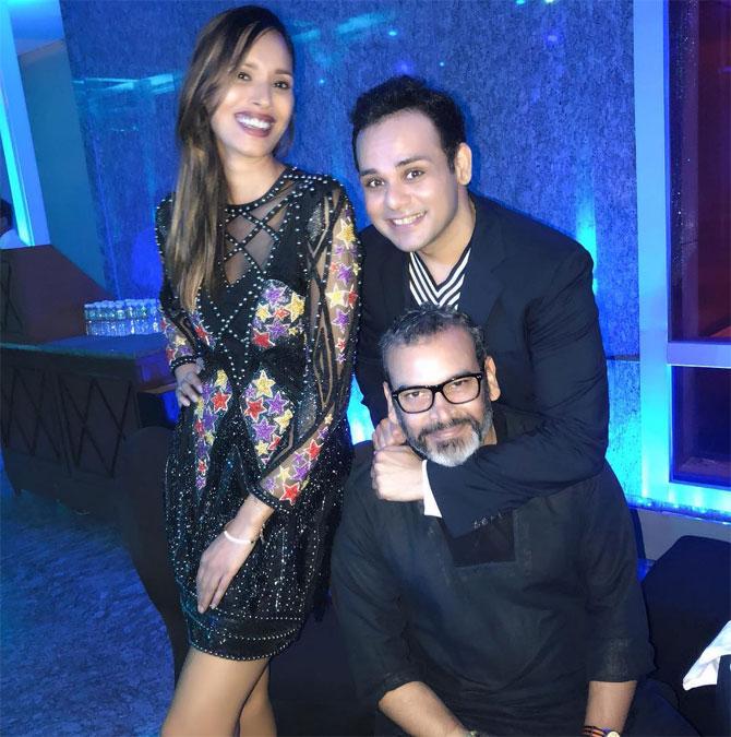 Raut gracefully poses with her friends in a sheer Falguni and Shane Peacock dress worn at a recent event.
