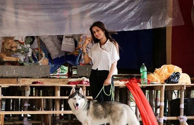Mimi looks chic in a white shirt and black pants as she spends quality time with Max.