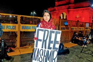 JNU violence: Protester seen holding 'FREE KASHMIR' placard, booked
