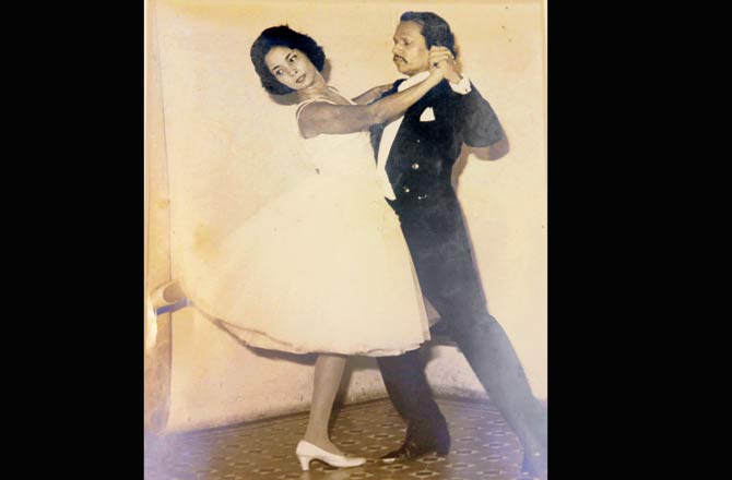 A photograph of Joao Joaquim Rodriguez and Dorothy striking a classic ballroom pose