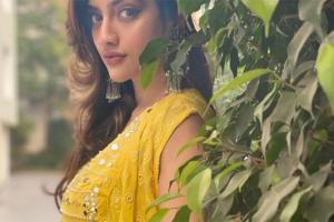 Nusrat Jahan looks fresh and bright in an all-yellow mirror work outfit