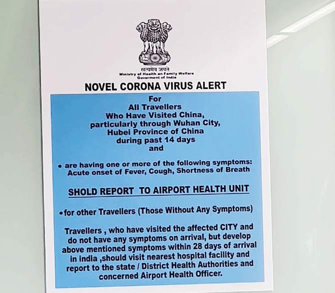 A notice asks passengers arriving in India from China and Hong Kong to report to the Airport Health Unit, following a government order to screen passengers