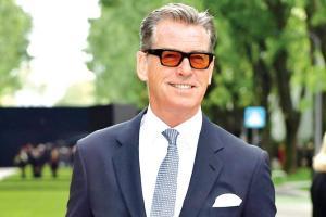 Pierce Brosnan, wife step out for a musical