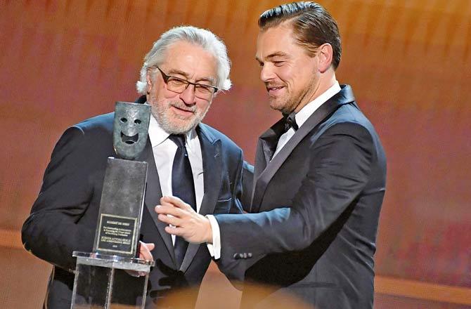 US actor Leonardo DiCaprio (R) presents to US actor Robert De Niro the SAG Life Achievment Award during the 26th Annual Screen Actors Guild Awards