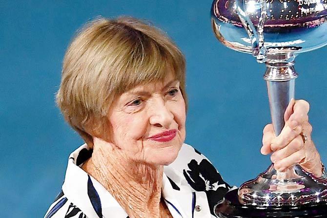 Margaret Court with a replica of the Australian Open trophy in Melbourne on Monday. PIC/AFP