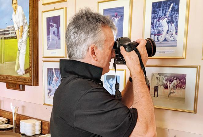 Steve Waugh focuses on a wall bearing images of great cricketers at the Cricket Club of India’s Polly’s Bar on Monday. PIC/CLAYTON MURZELLO