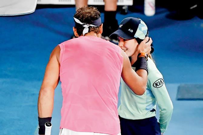 Rafael Nadal consoles a ballgirl after hitting her yesterday