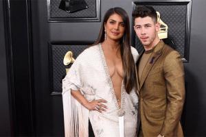 Priyanka's pierced belly button with plunging neckline dress looks hot