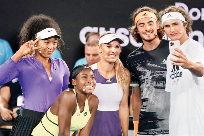 Alexander Zverev (extreme right) takes a selfie with Naomi Osaka (extreme left), Coco Gauff, Caroline Wozniacki and Stefanos Tsitsipas (second from right) at the Rod Laver Arena in Melbourne yesterday