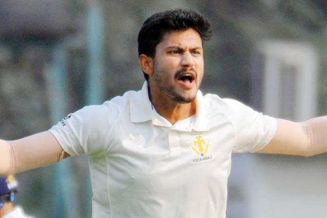 Karnataka pacer Vasuki Koushik appeals v Mumbai yesterday