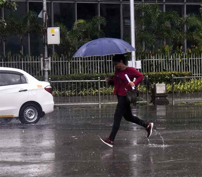 Finally, heavy rain lashed Mumbai after a relatively dry spell in June though Cyclone Nisarga triggered thundershowers in the city early last month. The cyclone had made landfall in Raigad and left a trail of destruction in the district.
In picture: A woman runs to take shelter from the rain in Sion.