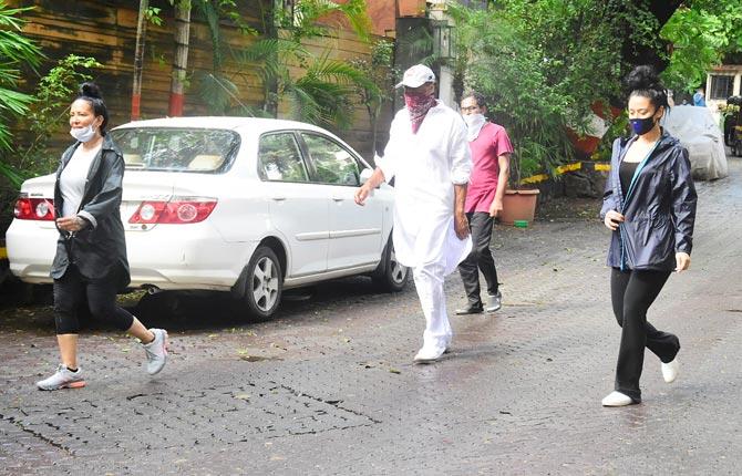 Krishna Shroff sported black track pants, paired with a basic black top and a windcheater during the outing.