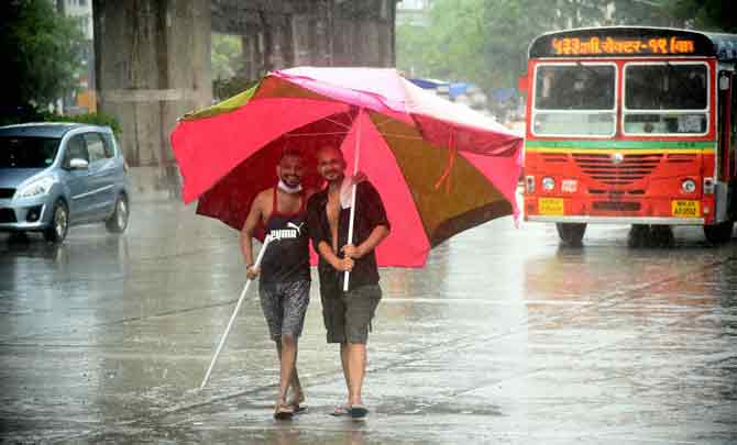 Two friends enjoy a stroll in the rain in Sakinaka.
