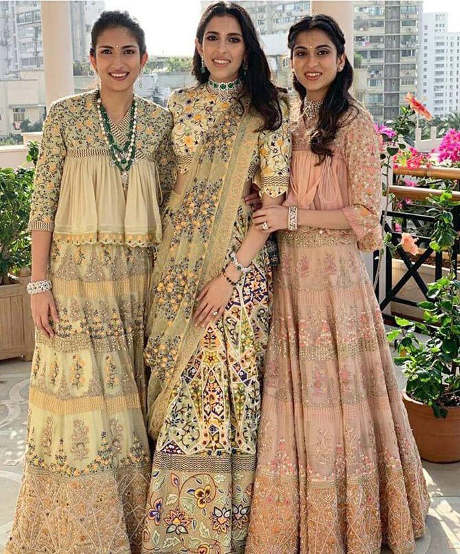 In September 2019, pictures of Shloka Mehta's pre-wedding festivities took the internet by storm. In the pictures, bride-to-be Shloka looked radiant in a multi-coloured lehenga choli as she posed for the lenses with her sister-in-law Nisha Seth Mehta and sister Diya Mehta Jatia. Pic/Instagram Rahul Mishra