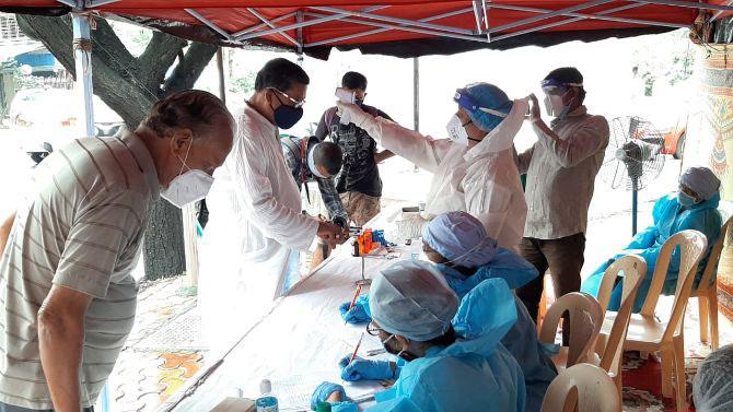 The BMC health workers conducted a medical check-up of residents of Mahavir Nagar at Kandivli.