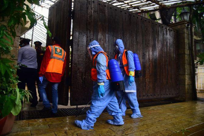 In photo: BMC workers arrive to sanitize the residence of Bollywood actor Amitabh Bachchan.
