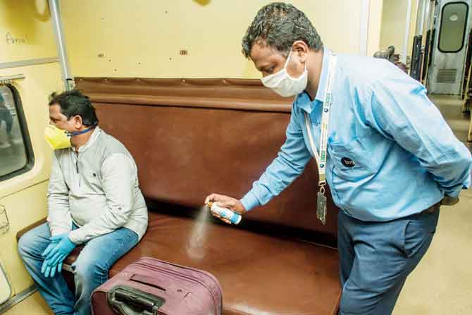 A passenger’s bag being disinfected with Godrej Protekt spray