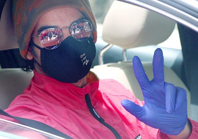 Ishaan Khatter was clicked wearing a face mask, gloves and other protective gear as he was spotted in his car.