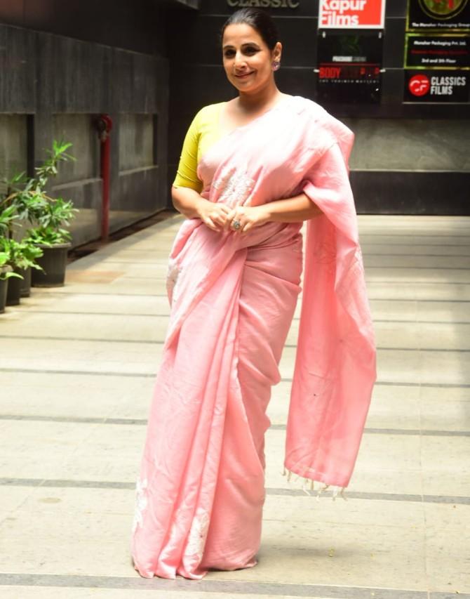 Vidya Balan loves to make in-character appearances to promote her films. The actress was spotted in her look from Shakuntala Devi when she was out to promote her upcoming film at her husband and producer Siddharth Roy Kapoor's office in Bandra, Mumbai. The actress looked graceful in her pink saree and green blouse. (All pictures: Yogen Shah).