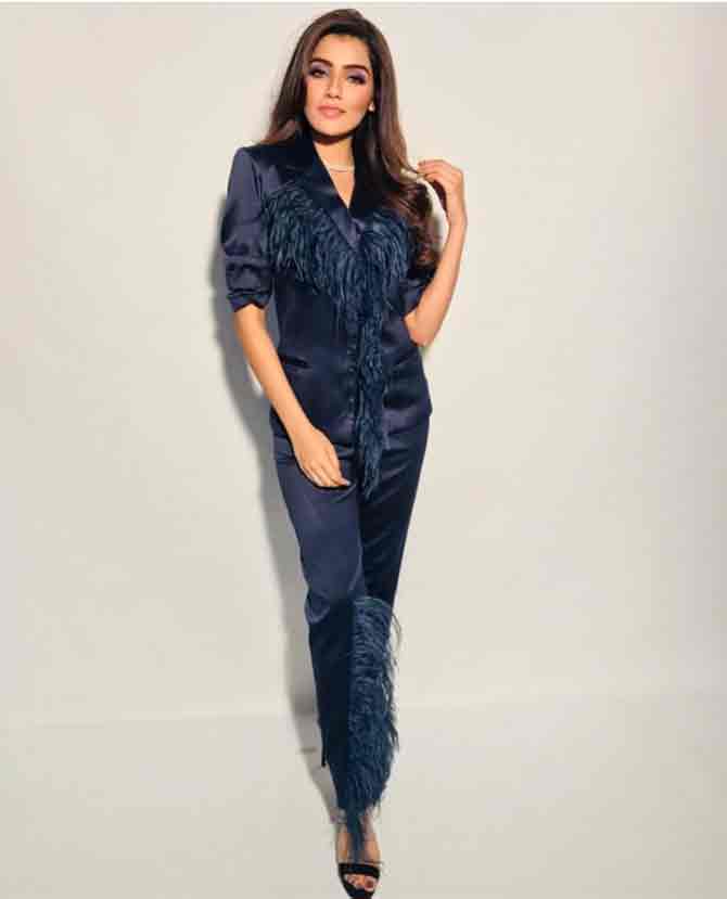 Miss India Supranational 2017 Aditi Hundia stuns in a navy blue silk pantsuit with feathers on the collar adding an edge to her formal look.