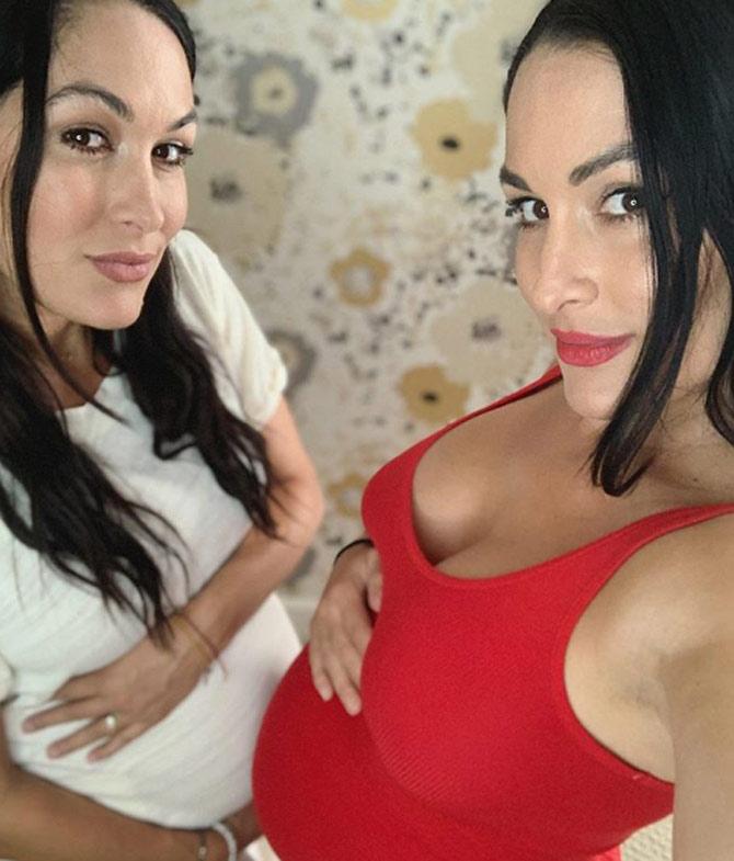 Nikki Bella and her twin sister Brie Bella, both announced their pregnancy on the same day! Here she posted a photo along with Brie and wrote, 