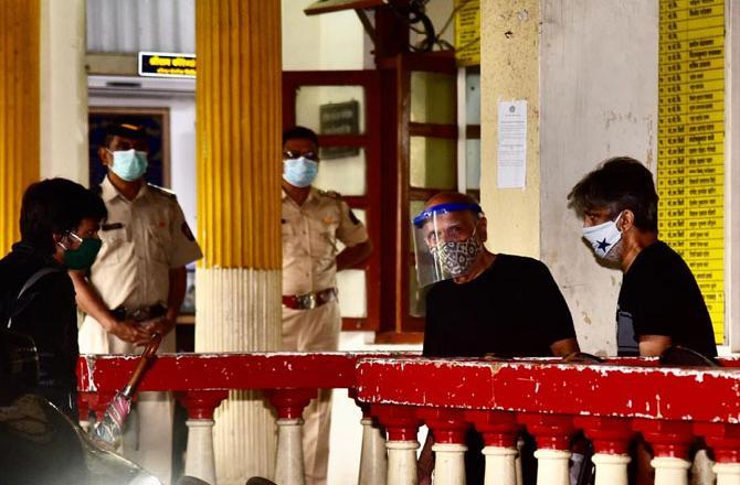 In Photo: Filmmaker Mahesh Bhatt leaves Santacruz police station after recording his statement.