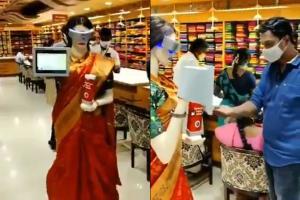 Watch Video: Mannequin offers sanitiser to customers at textile store