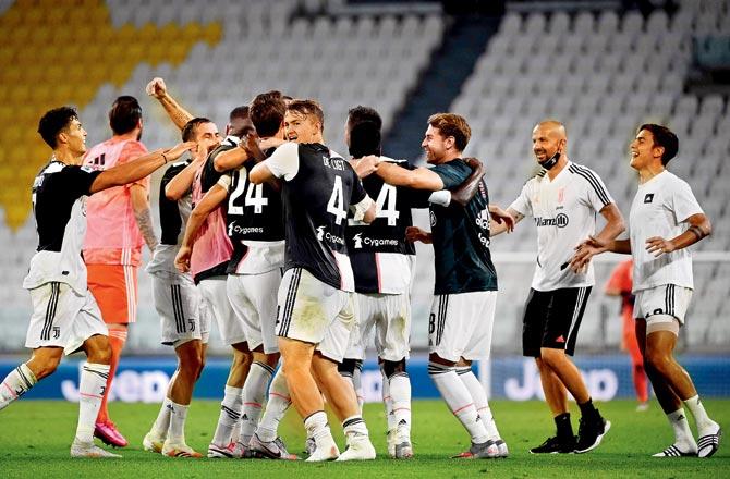 Juventus players are ecstatic after beating Sampdoria 2-0 at the Allianz Stadium in Turin on Sunday to win the Sere A title