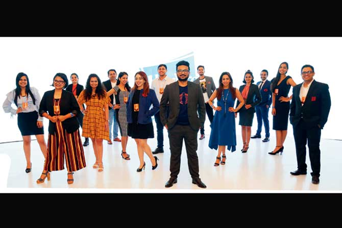 Black White Orange Brands Pvt. Ltd co-founders Mitali Desai (in blue dress), Diksha Mehta (in blue jacket) and Bhavik Vora (centre) with the team