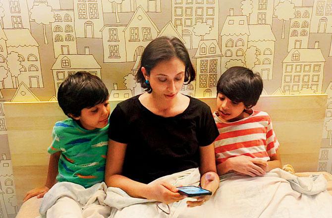 Shreedevi Sunil browses through the website with her sons