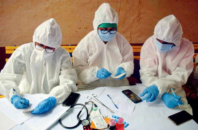 BMC health workers sort test samples at Dadar