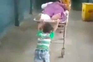 6-year-old pushes grandfather's stretcher as ward boy demands Rs 30