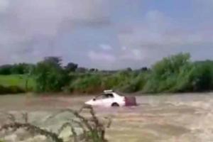 Watch video: Car washed away in overflowing stream after heavy rain