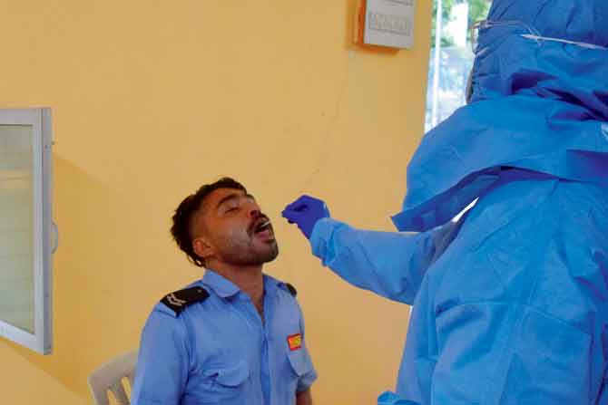 BMC health workers screen residents and conduct swab tests at Rawool Maidan, Prabhadevi. PIC/ASHISH RAJE