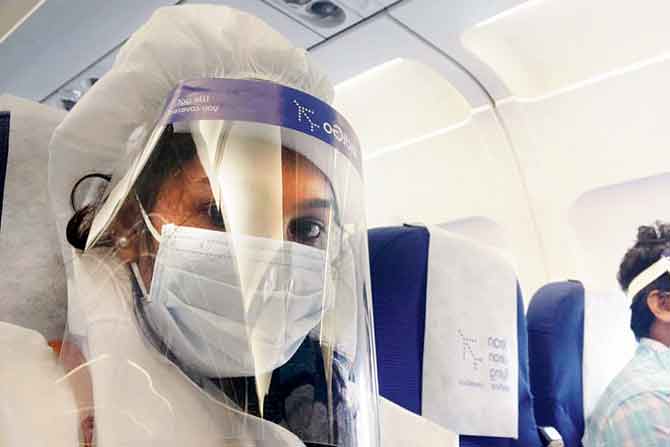 Amrutha in PPE on the flight to Kochi