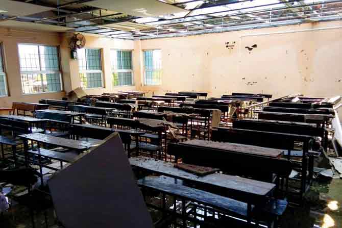 Damaged benches in a classroom