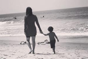 Sunny Leone takes her 'little nugget' for a stroll on the beach!