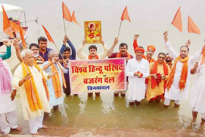 Vishwa Hindu Parishad (VHP) and Bajrang Dal workers after collecting sacred water and clay from the River Ganga, for the bhoomi pujan at the site of the Ram temple in Ayodhya, at Vindhyachal Dham in Mirzapur. PIC/PTI