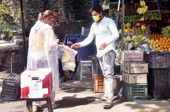 A woman shops at Pali market, Bandra. Pic/Pradeep Dhivar