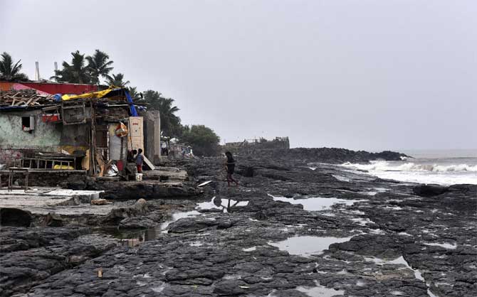 Those violating the order can face action under IPC section 188 (defying an order lawfully promulgated by a public servant), the statement read.
In picture: Residents of Ganesh Nagar near Bandra Bandstand prepare themselves from the impact to be caused by the Cyclone Nisarga