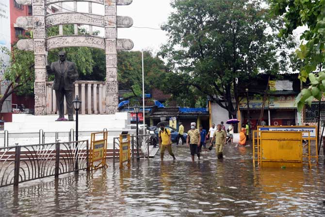 According to a statement by the Maharashtra government on Thursday, six persons lost lives in incidents related to the cyclone while 16 suffered injuries in the state. Six cattle were also killed.
In picture: Pedestrians wade through a water-logged street at Ramabai Nagar in Ghatkopar.
