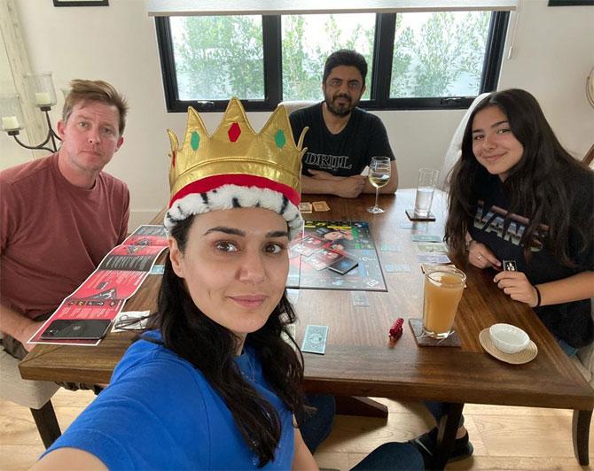 Preity Zinta and family are also keeping themselves occupied by play board games at home. She shared this photo of her playing with husband Gene Goodenough and others and wrote, 