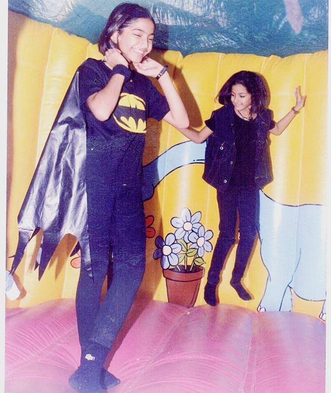 Sonam Kapoor posted this picture with Rhea and captioned it: DIY Batman costume for a party that wasn’t fancy dress because he was my favourite super hero. Also jumping and dancing with my partner @rheakapoor is still my favourite thing to do. (Yes those are batman socks and yes I was a nerd)
