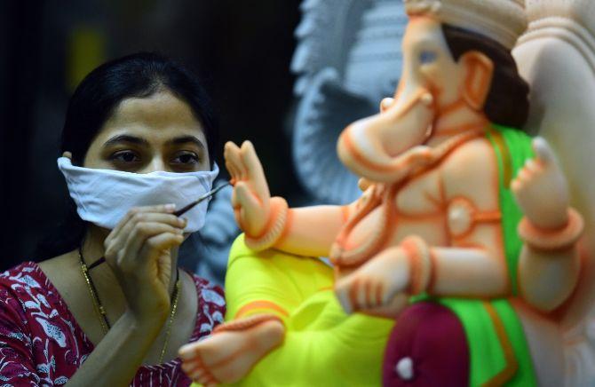 Amid the Solar Eclipse event and celebrations of Father's day, Ganesh Idol makers in South Mumbai's Girgaon area were snapped by mid-day lens as they gave final touches to Ganpati idols ahead of the Ganesh Chaturthi festival in the city.