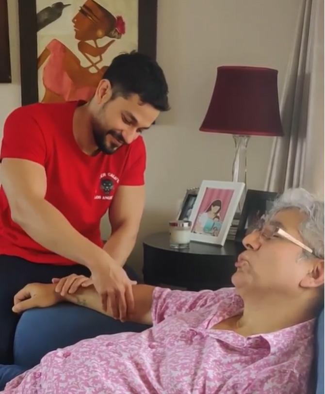 Sharing a cute picture of him doing a hand massage to his father, Kunal Kemmu captioned the picture, 